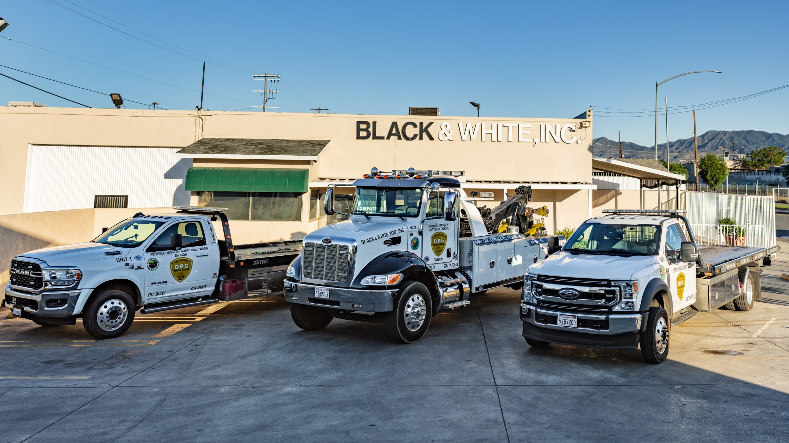 Black & White Towing Inc. trucks